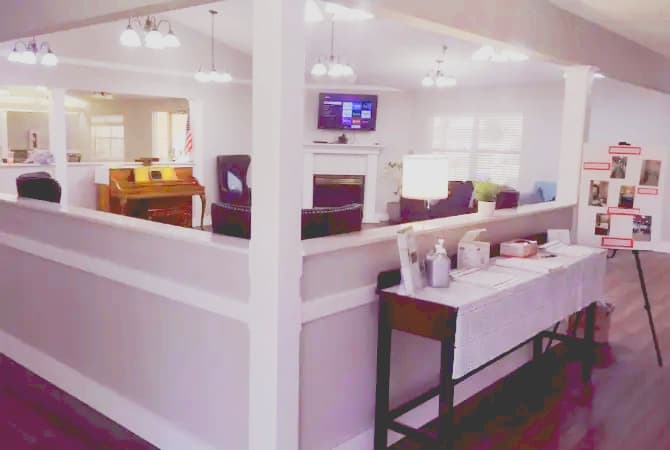 Bright common area at Pine Lodge where assisted living residents gather for activities