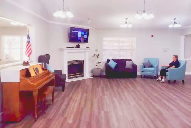 Resident relaxing in the Pine Lodge lounge after moving in